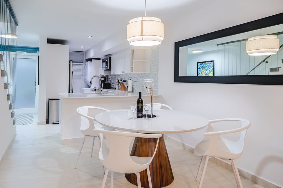 Dining area with table for 4 guests.