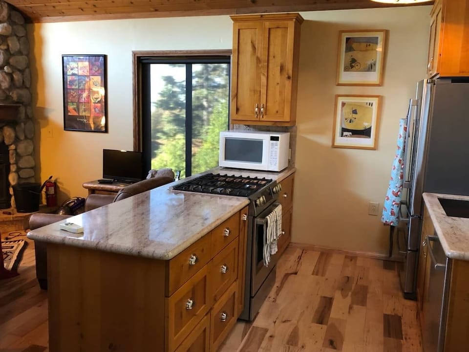 Kitchen island, with gas range and convection microwave.