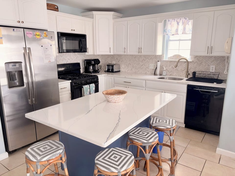 Quartz countertops with every appliance and cookware you would need 