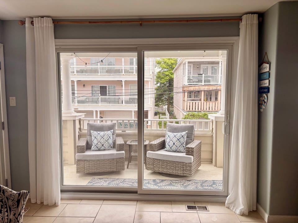 Brand new sliding glass door opening to the huge front balcony 