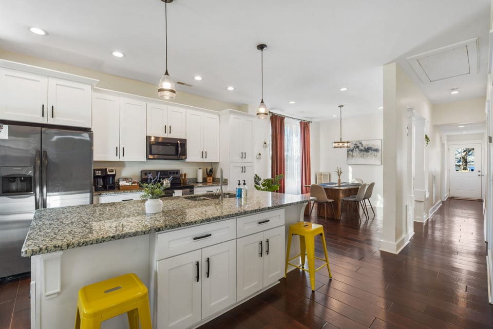 Kitchen area with a large granite island