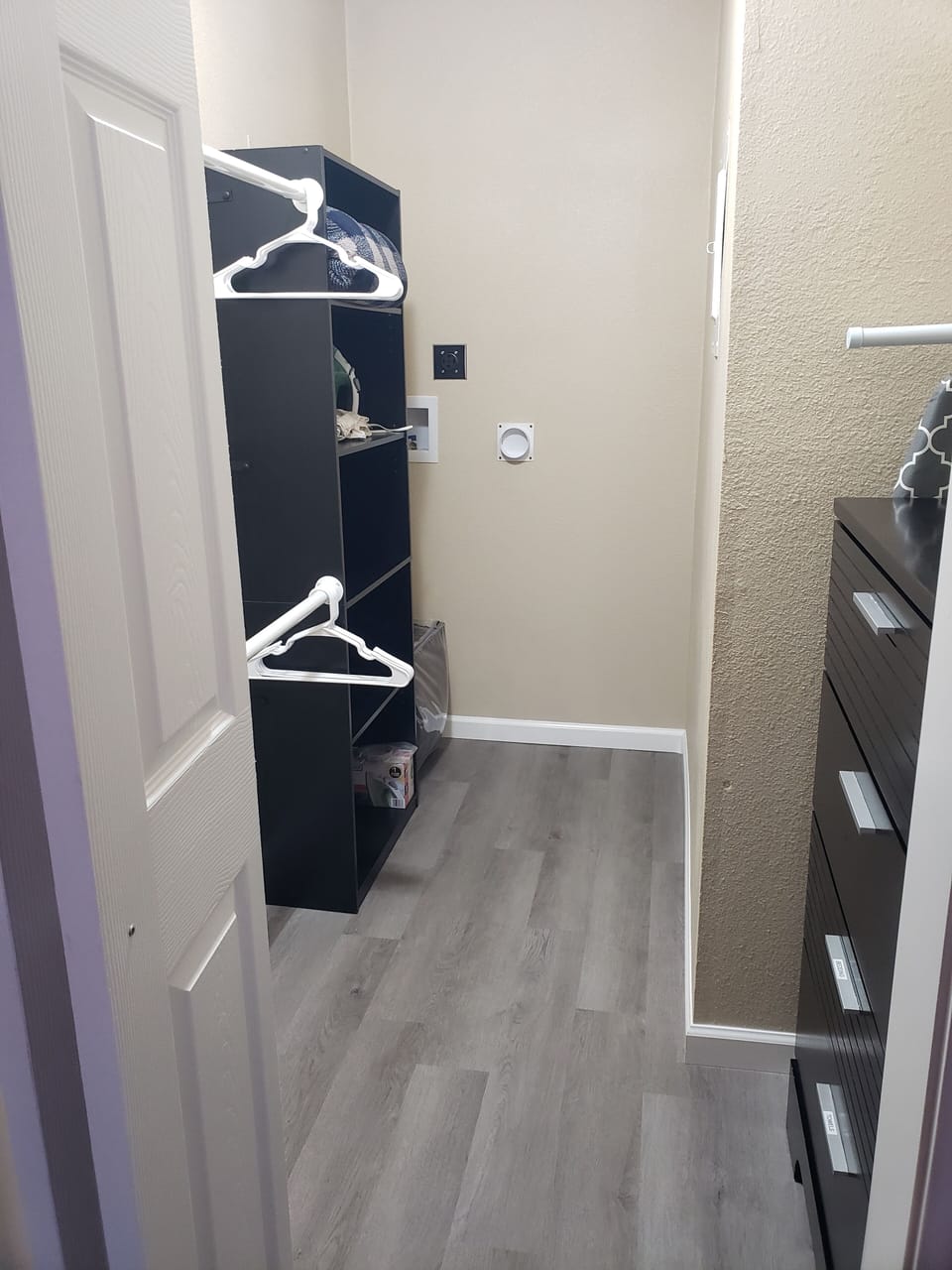 Spacious walk in closet! Shelving, top drawers, and hangers for your use.