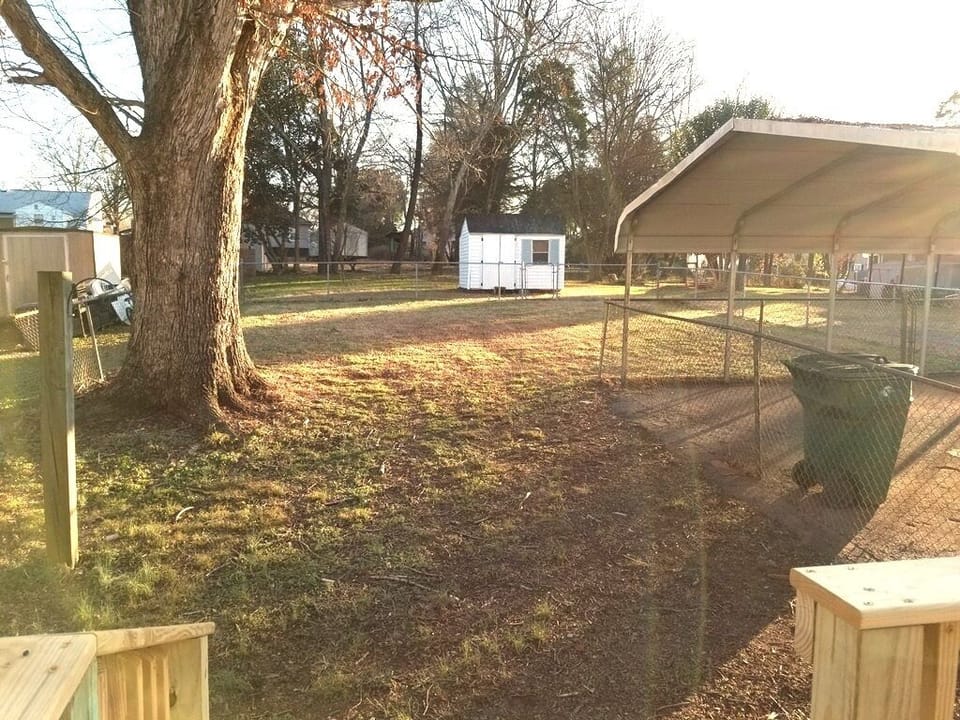 Back yard with a 2-car carport.