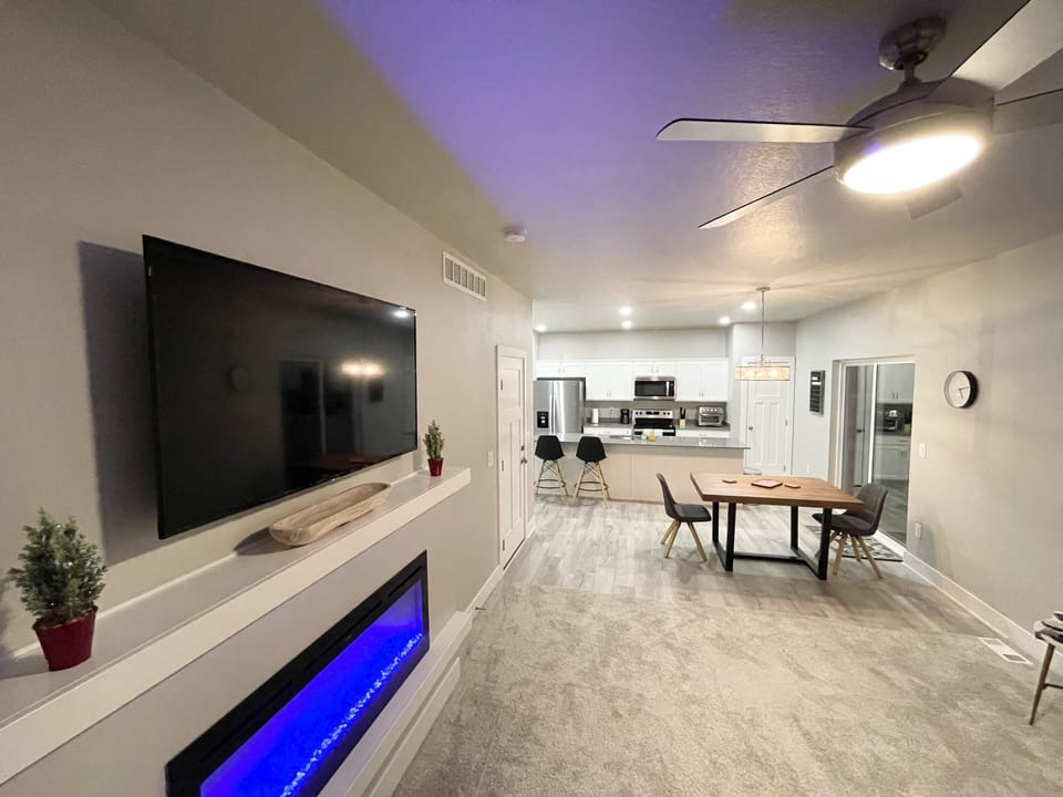 Living area w/ Dining Table that seats 6 with 2 additional seats at bar counter