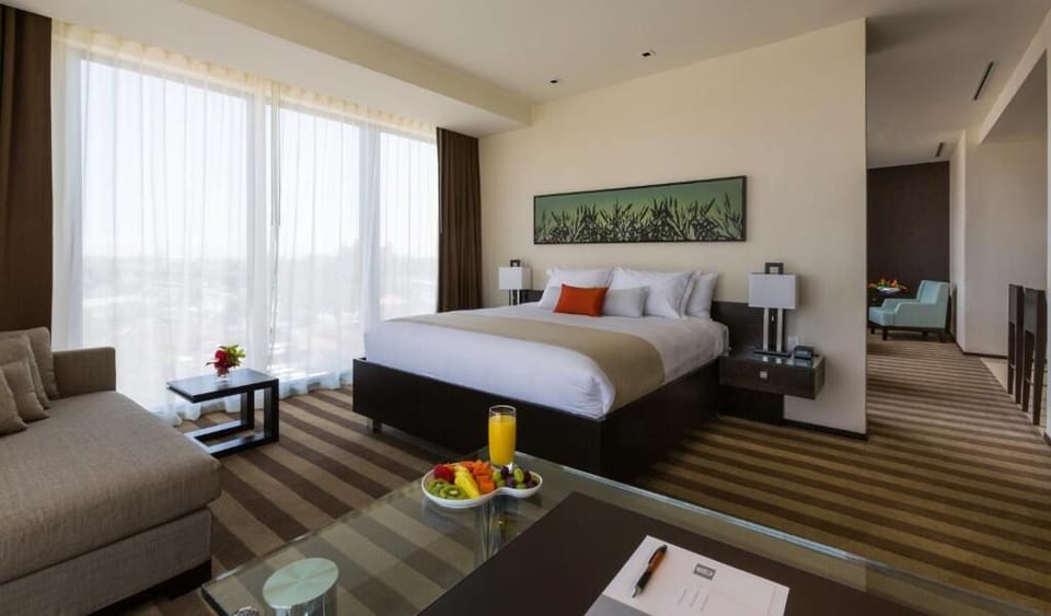 Unit with 1 King bed. Exact unit will be assigned upon arrival. Views, colors, and decor may vary.