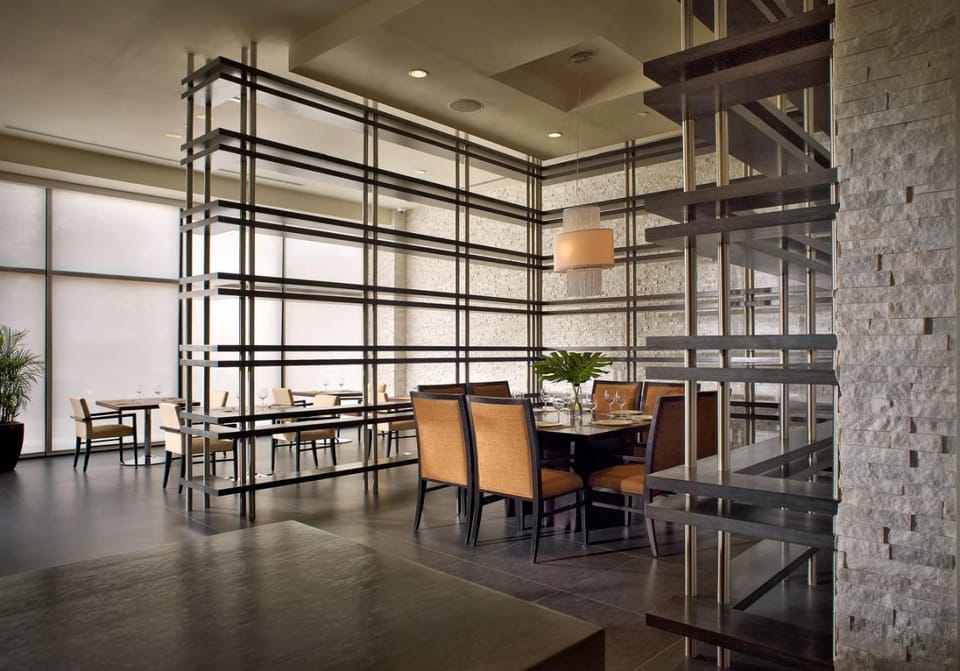 Gather for relaxed meals in the airy, design-forward dining room