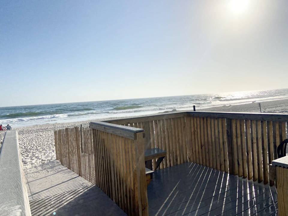 Boardwalk is only 5 steps and you are on the white sandy beach.