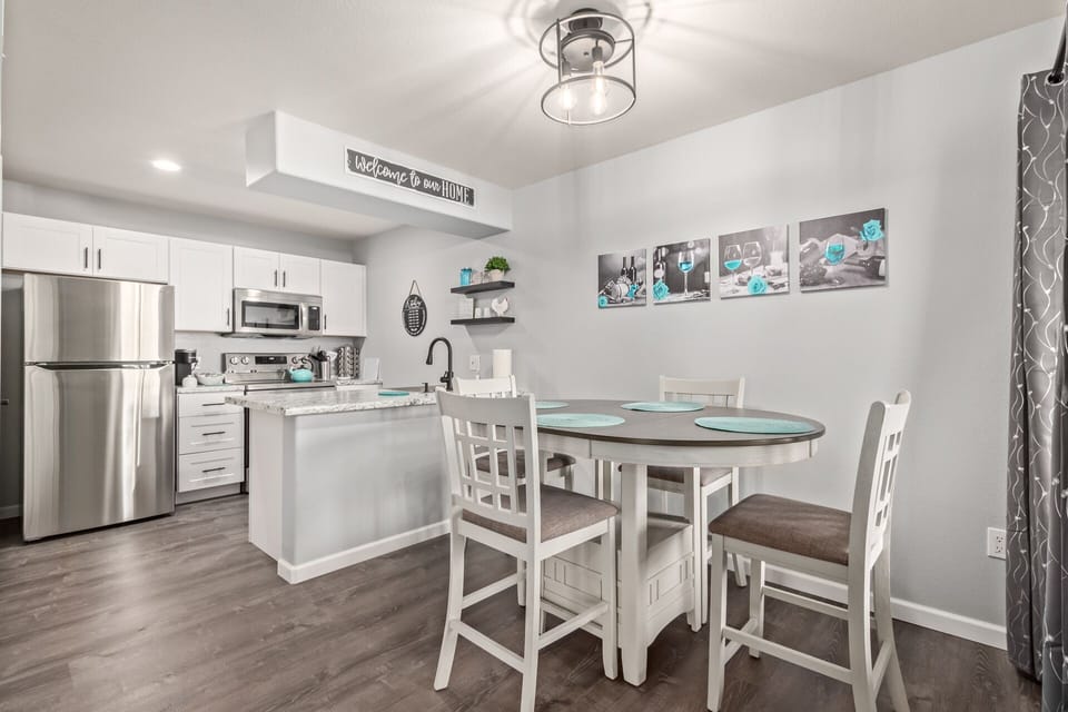 Dining room and kitchen.  We have replaced table with new standard height table.