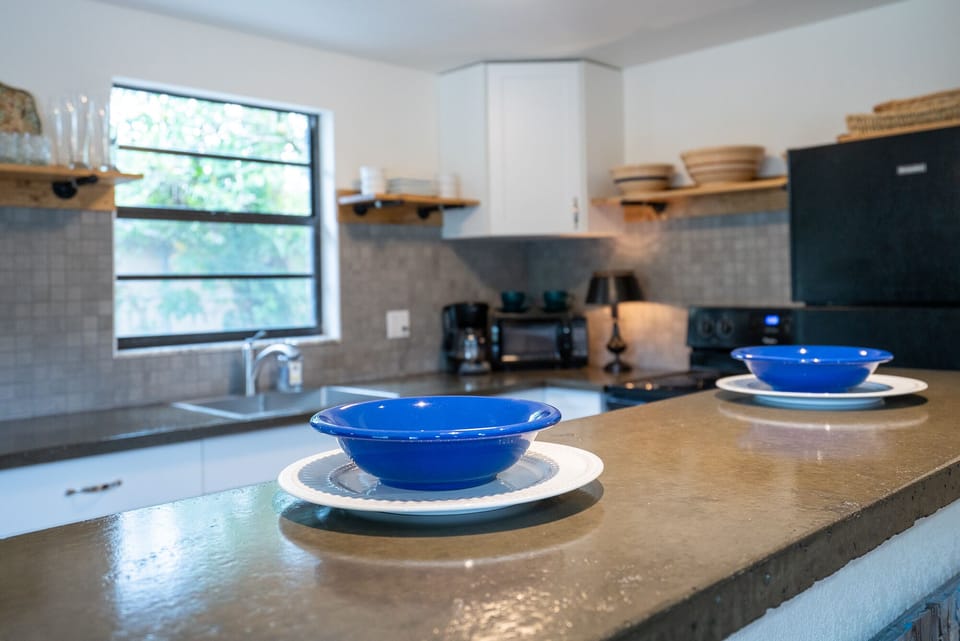 Grab a bite to eat at the bar that connects the living room and kitchen.