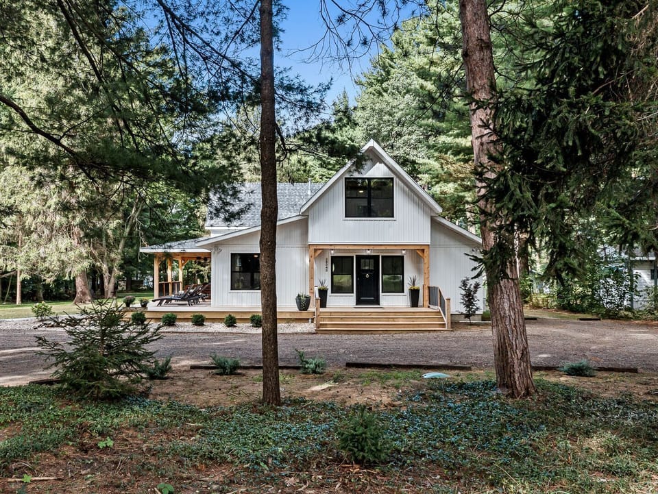 Modern farmhouse set on Saddle Lake with private waterfront access