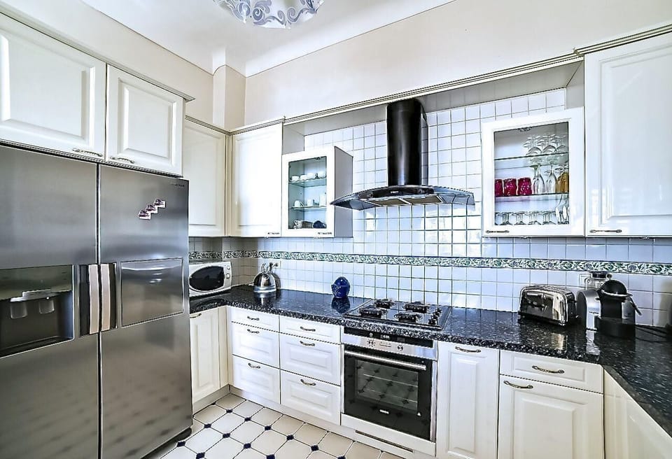 Kitchen area. Grey bedroom