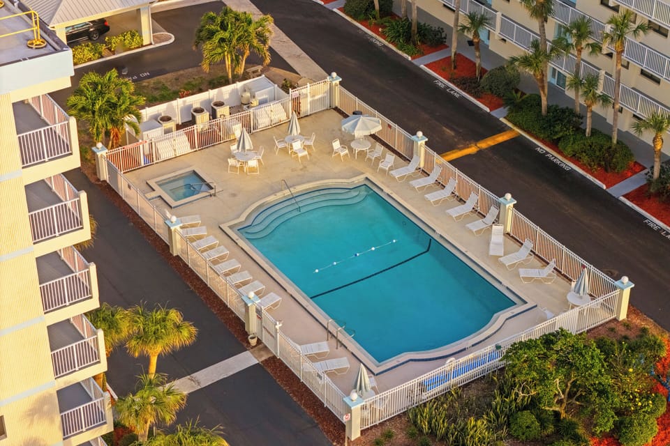 Lounge by the large heated pool surrounded by plenty of seating for sunny days and peaceful evenings