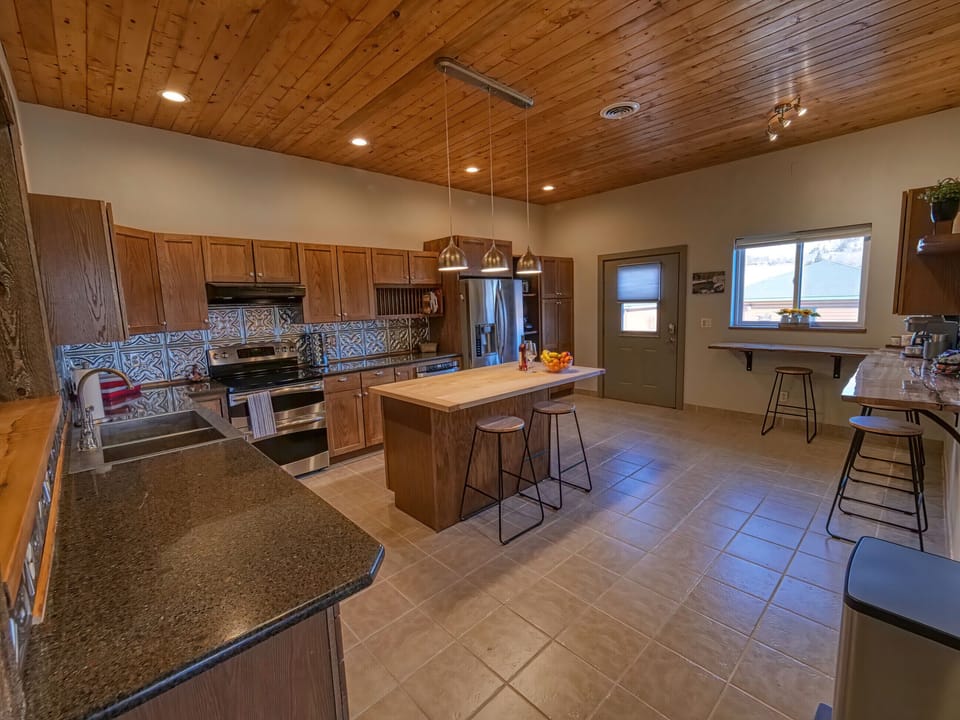 Large kitchen to gather and prepare meals 