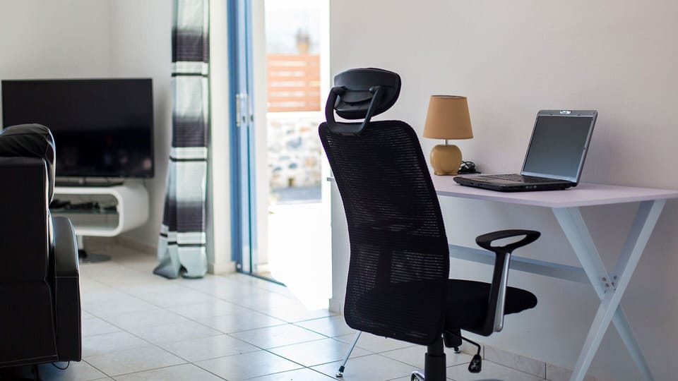 Office desk next to the living room