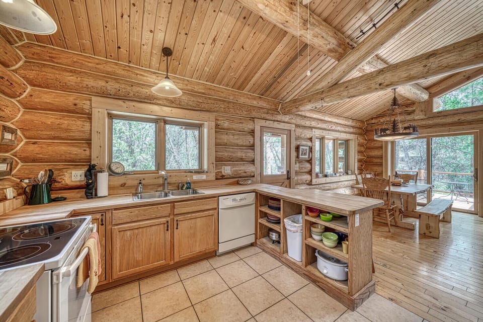 Fully-appointed kitchen with bar seating.