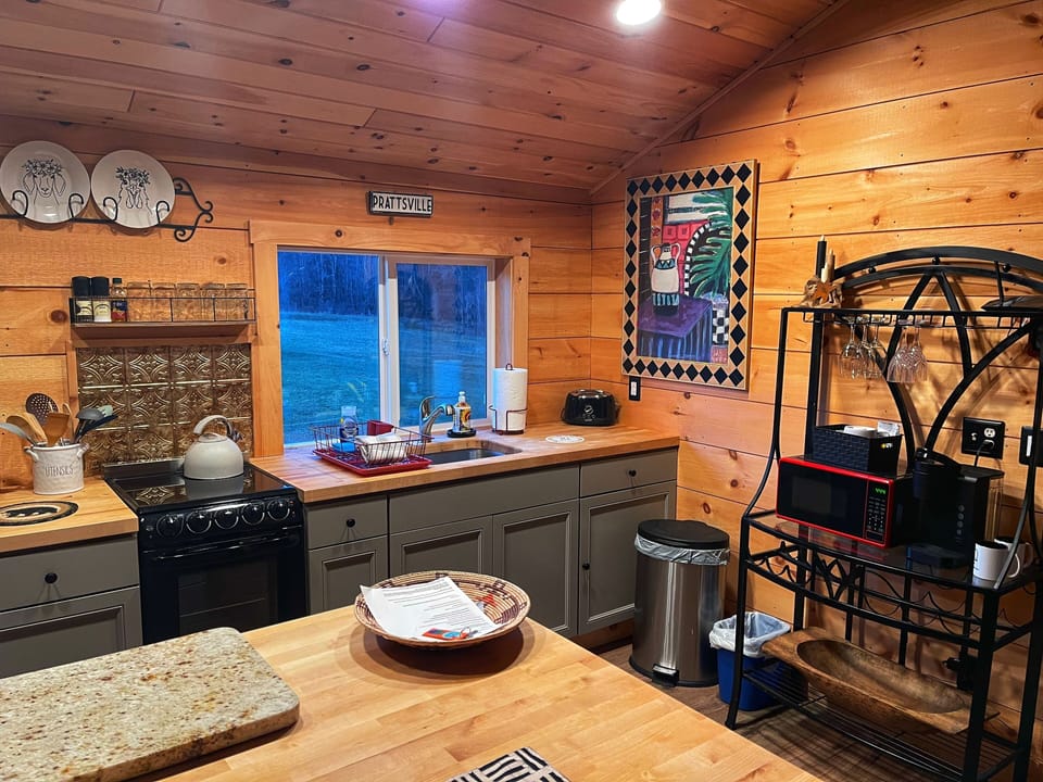 Kitchen is fully equipped: utensils, pots and pans, oven, stove top, microwave 
