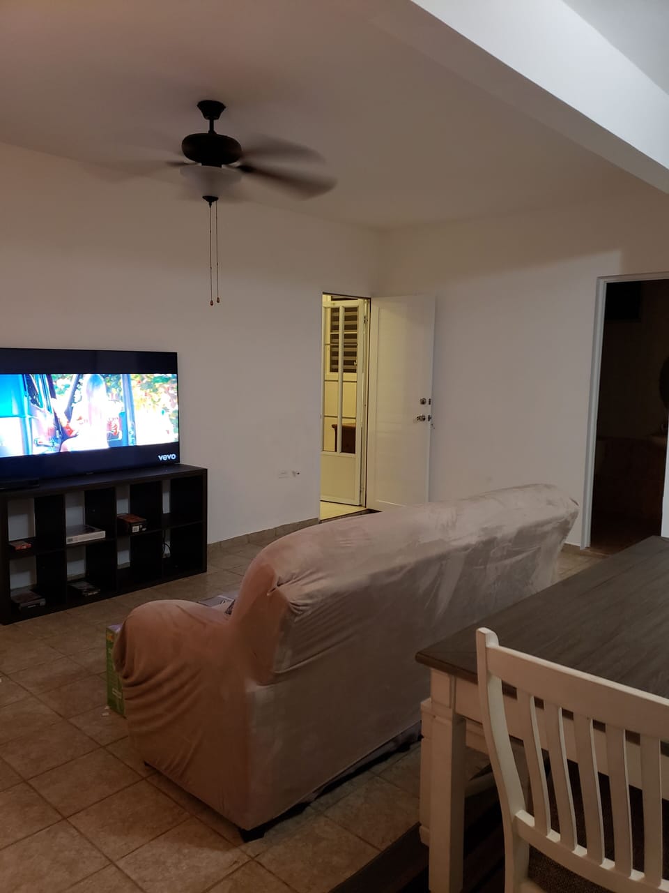 living room with 65 inch smart t.v. & 2 couches