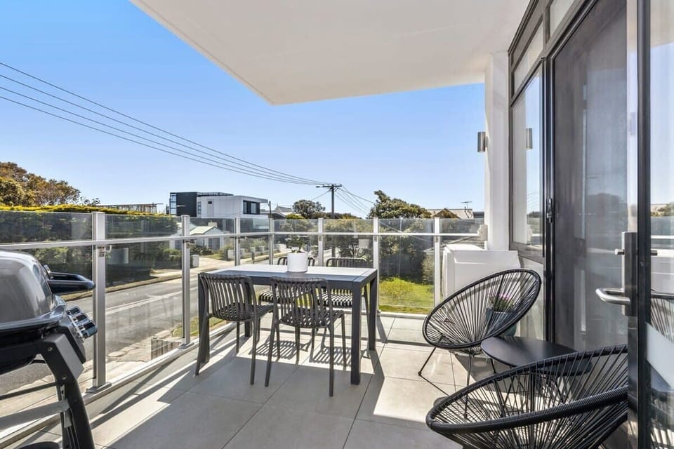 The north-facing balcony with outdoor dining and a BBQ is a hit with guests who love alfresco meals