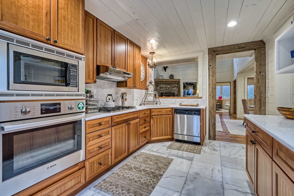 Modern kitchen with stainless steel appliances and warm wood cabinetry