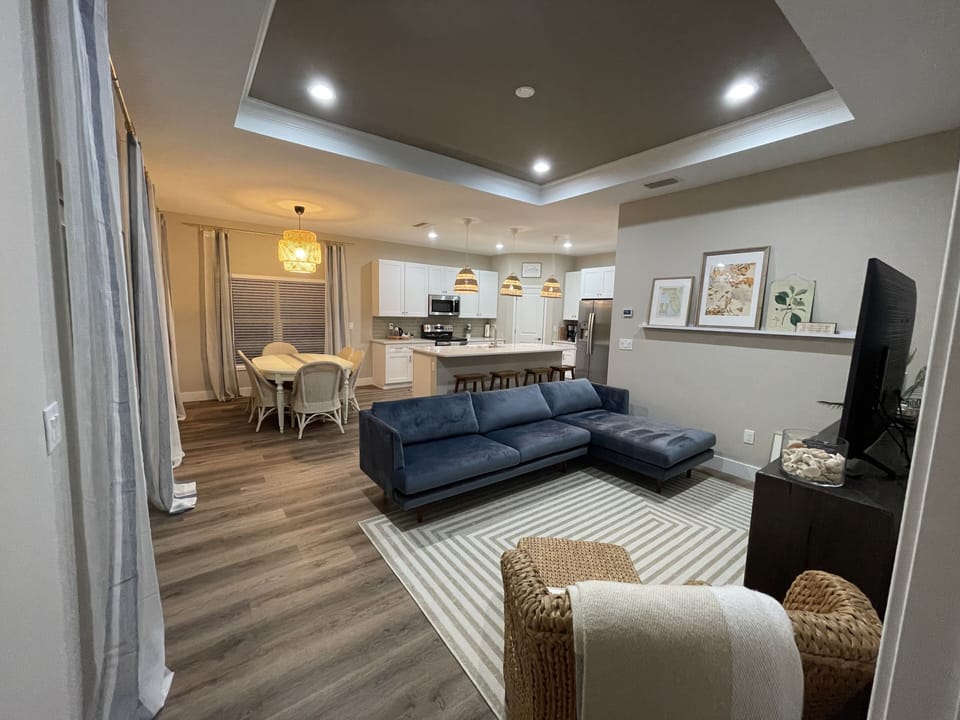 Living room with open concept to kitchen and dining room 