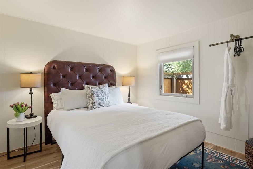 Your bedroom with plush linens and queen-sized bed.