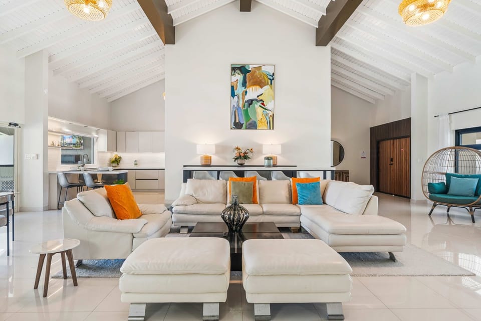 Relax in style in our inviting living room, boasting plenty of couch space and a generously sized TV.