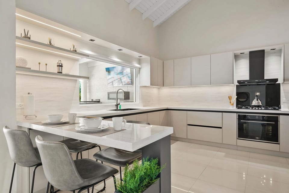 Start your day right in our inviting kitchen, complete with a convenient breakfast bar