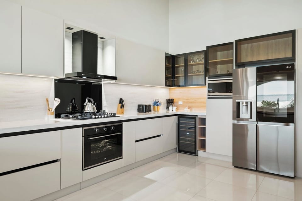 Welcome to our inviting oasis, where the kitchen opens up into the living room