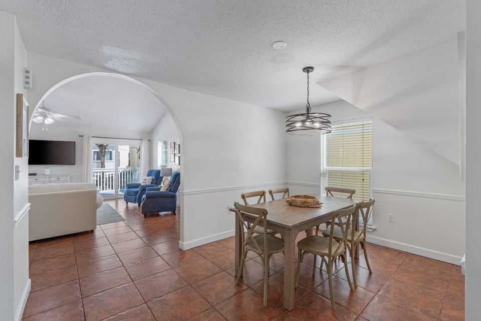 Gather around your spacious dining table for memorable meals, while the open-concept design connects you seamlessly to the comfortable living area.
