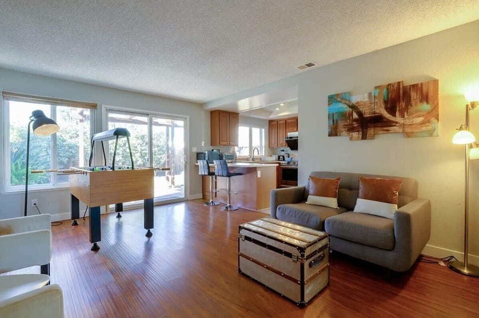 Guest-friendly entertainment space beside kitchen