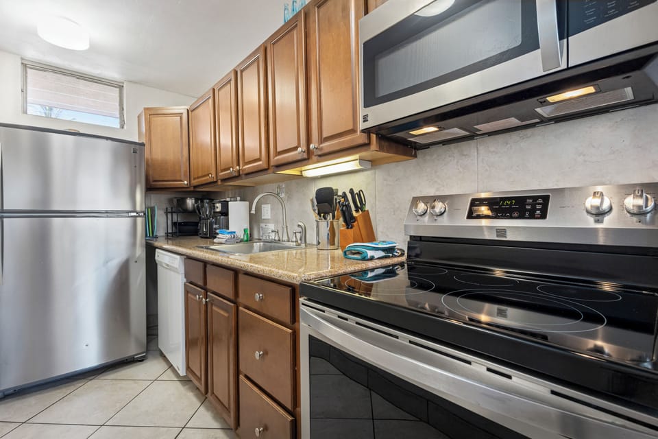 Your fully equipped kitchen awaits with stainless steel appliances, ample counter space, and everything you need to prepare delicious meals during your stay.