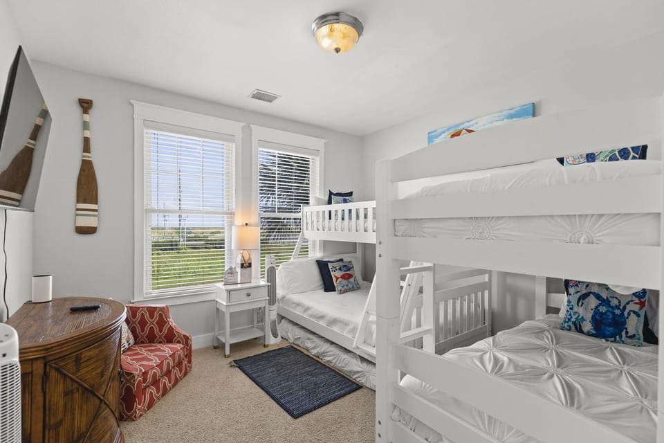Bunk bedroom offers a twin over full bunk bed and a twin over twin bunk bed. 
