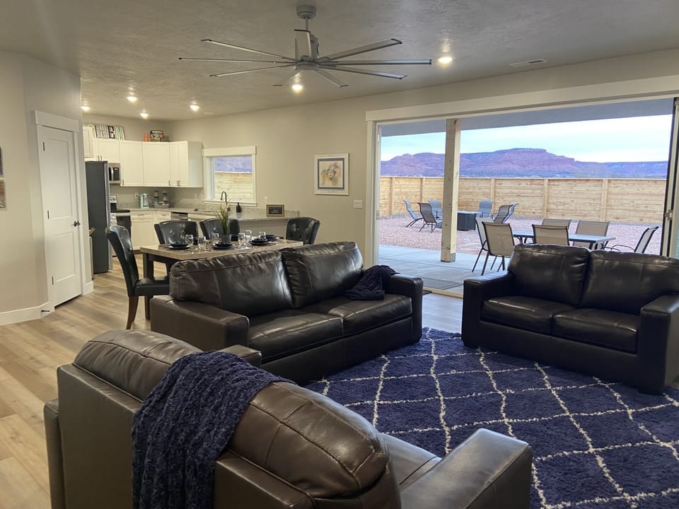 Great room view, family room, kitchen framed by the 14 foot bi-folding door. 