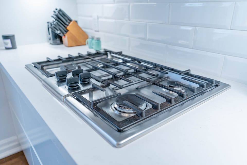 A 4 burner gas stove provides instant heat