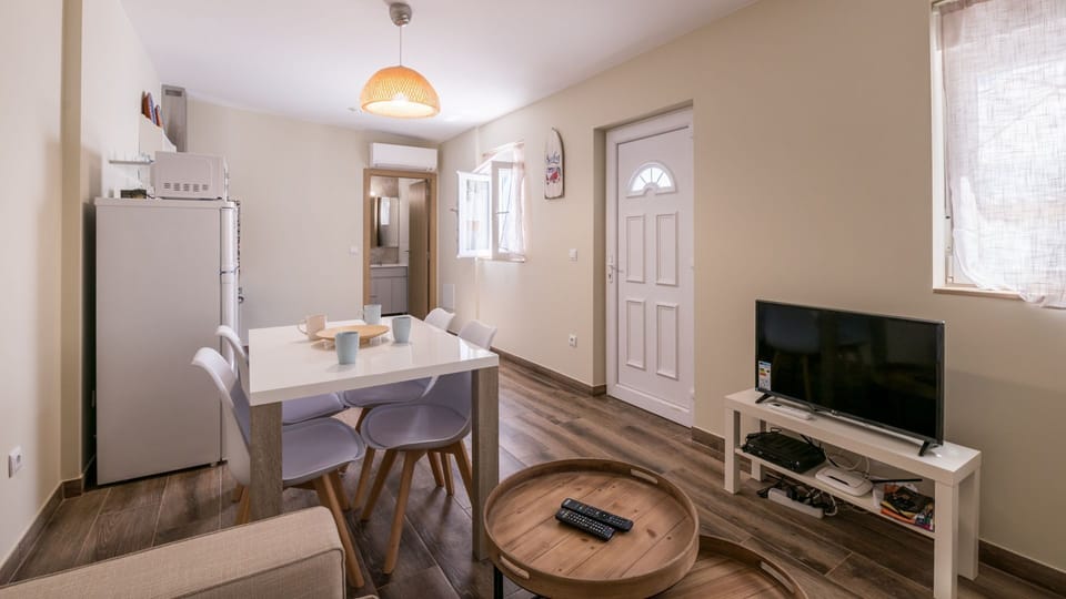The living area comes with all you could require during your stay, including an AC!