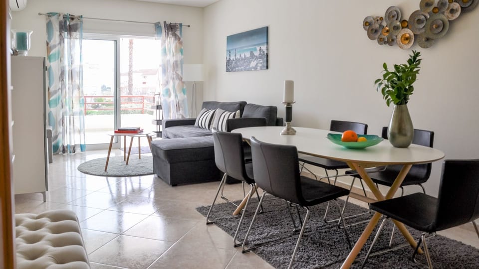 The living room features a comfortable seating area and a dining area with space for up to 6 people. The spacious terrace can be easily accessed through the living room

#modern #cosy