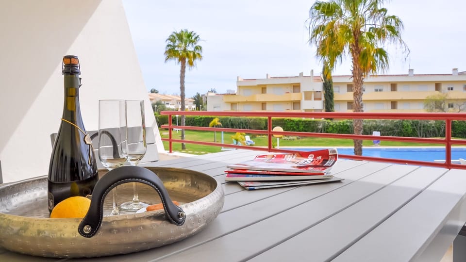 The terrace features a seating area with space for up to 6 people and a BBQ