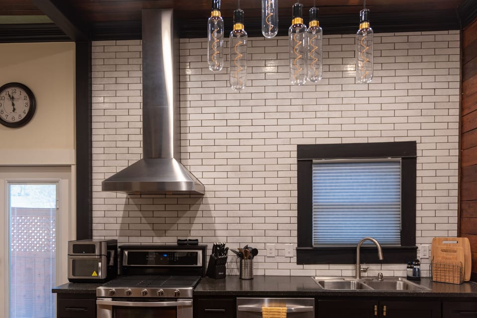 Air Fryer, gas stove & oven, range hood, cutting boards, hot pads & dish washer.