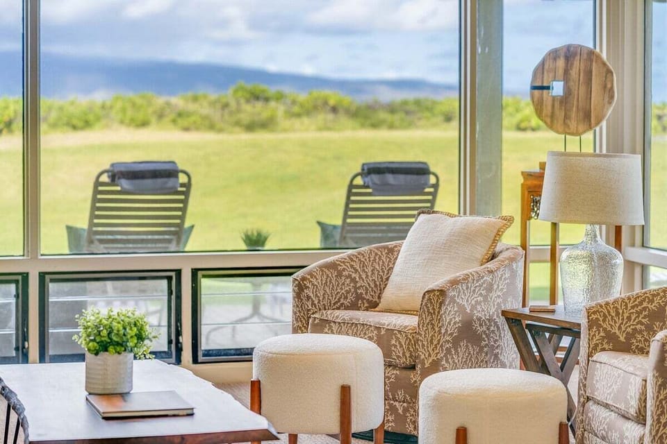 Relax in a modern living space with plush seating and open views.