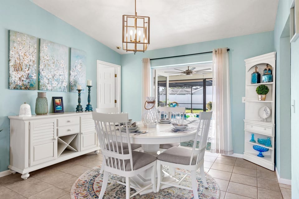 The formal dining area offers a table set for 4