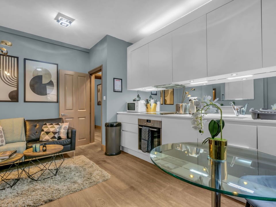Furniture, Interior Design, Flooring, Floor, Wood, Ceiling, Room, Cabinetry, Light Fixture, Lighting
