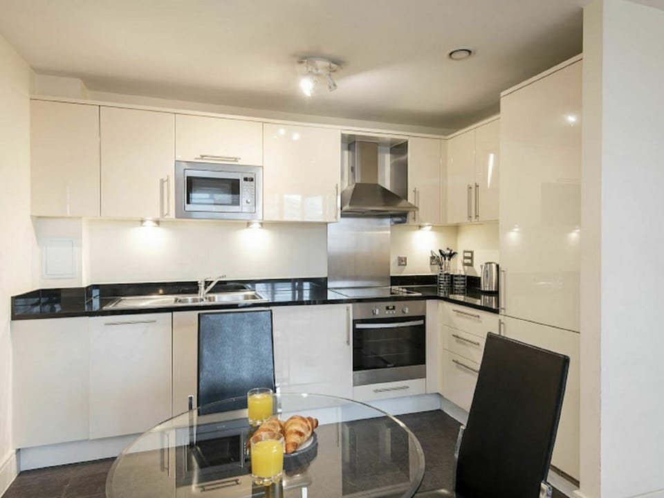 Cabinetry, Countertop, Kitchen Appliance, Kitchen Stove, Kitchen, Sink, Tap, Kitchen Sink, Building, Lighting