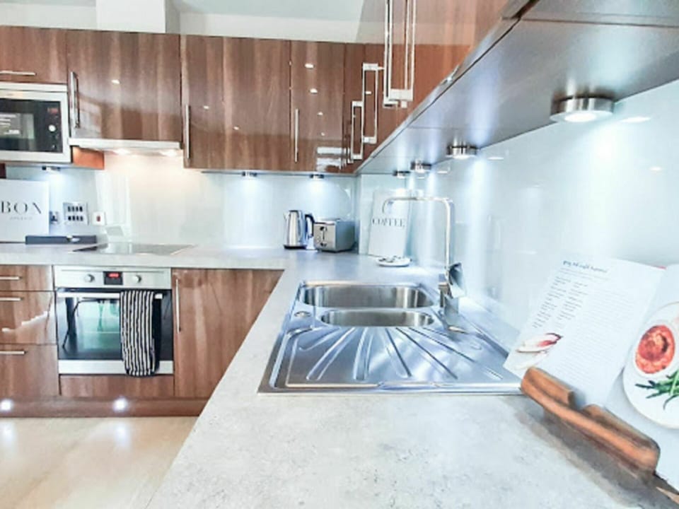 Cabinetry, Countertop, Kitchen Appliance, Kitchen, Kitchen Stove, Interior Design, Wood, Flooring, Floor, Major Appliance