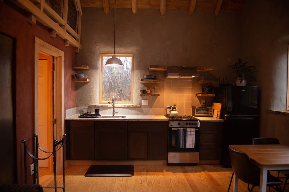The full kitchen provides everything needed to cook, plus organic coffee and tea