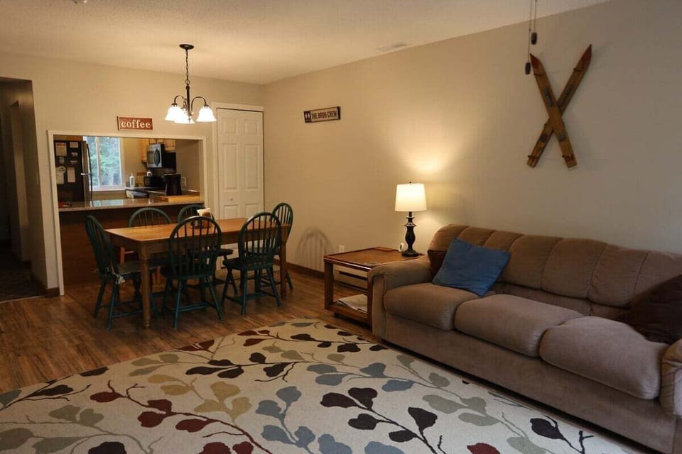 Living/Dining Area With Slider to Private Balcony in Waterville Valley Condo