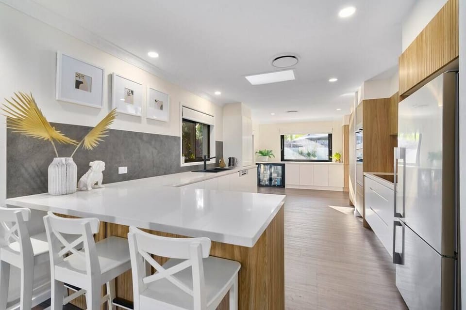 Sorrento Oasis kitchen has island seating, fridge and generous cabinetry.