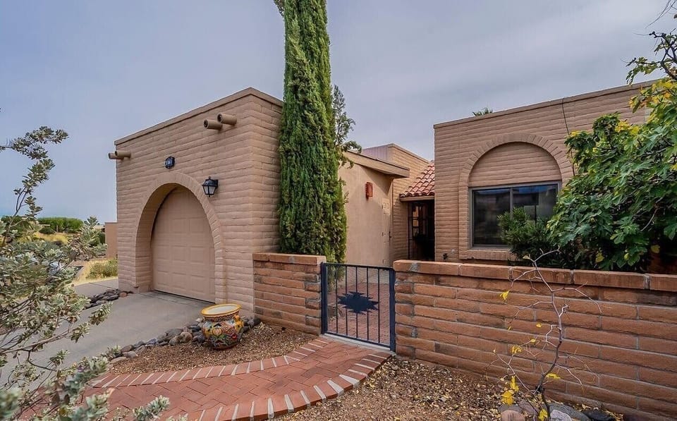 Front of house including one car garage on the left