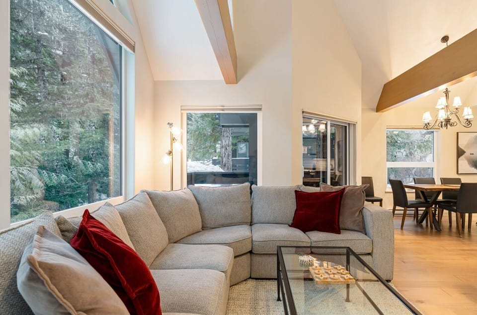 Soak in forest views from the cozy living room.