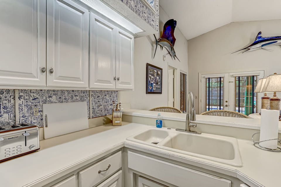 Fully Equipped Kitchen with Bar Stool Seating for Three