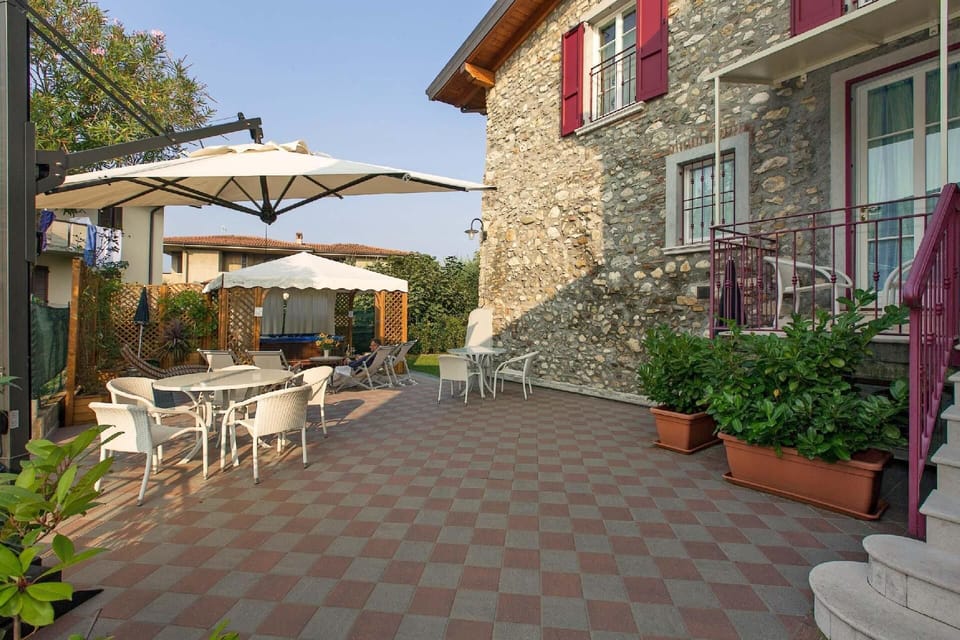 Reserved table and sun umbrella on terrace